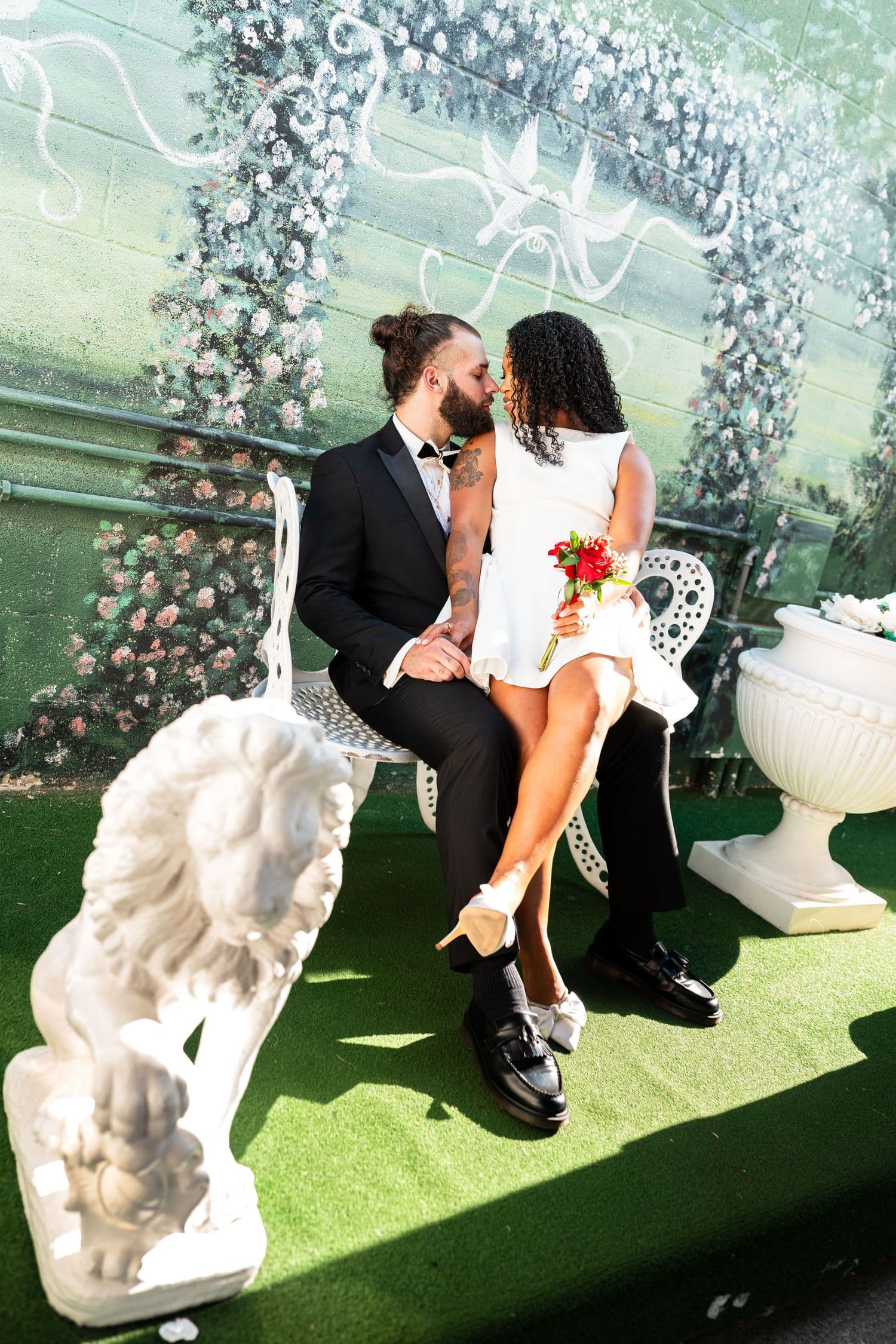 Garden ceremony with a floral arch and white decor