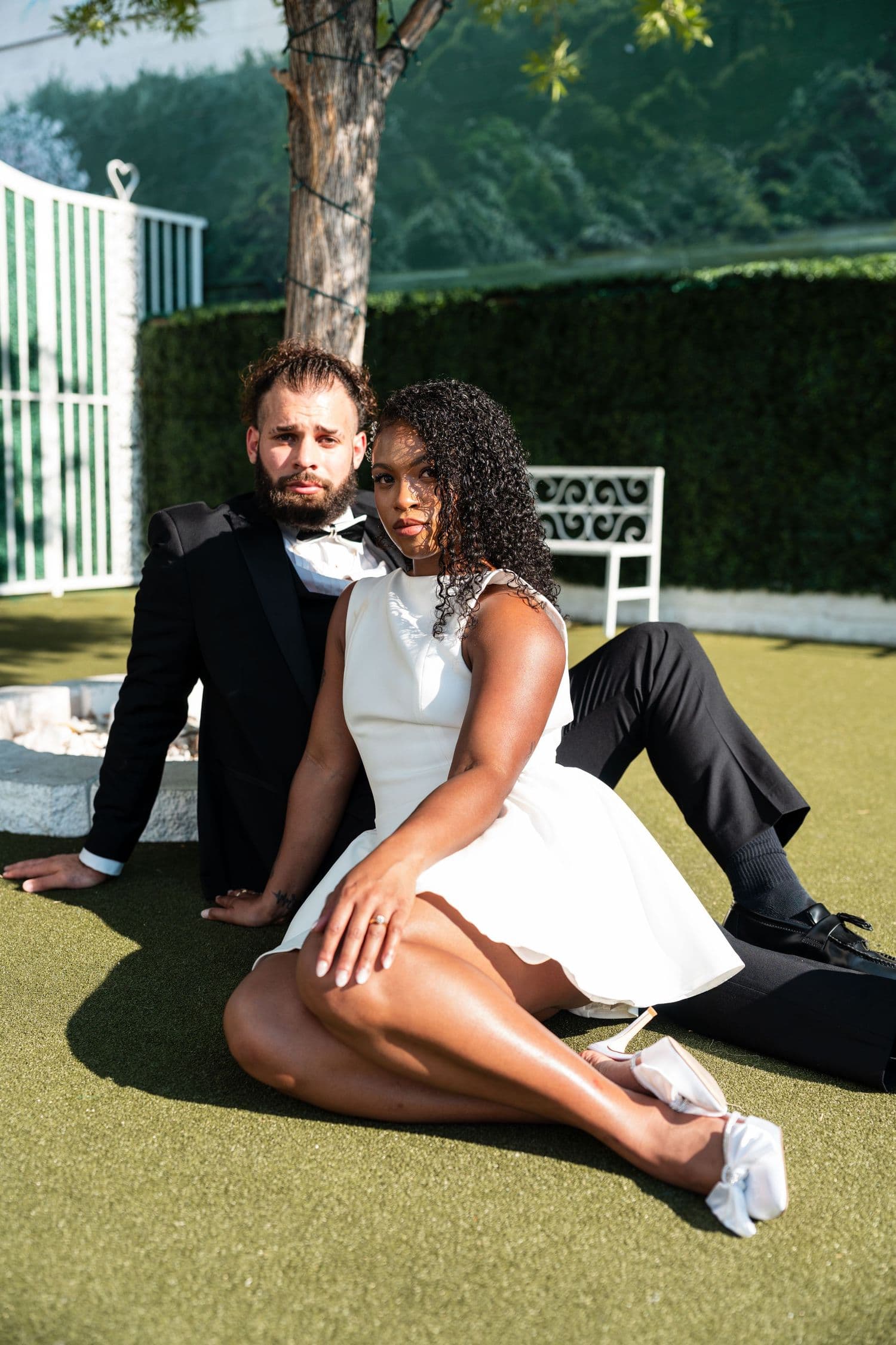 Couple relaxing on artificial turf
