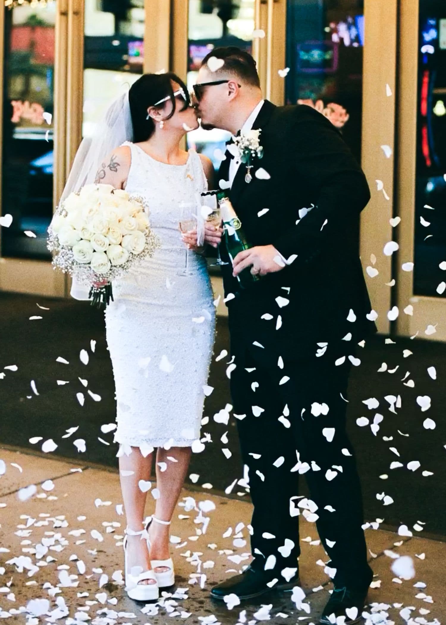 Flower petals falling around a couple during their celebration